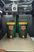 Two miniature Canada Dry ginger ale can holders. Sold separately.